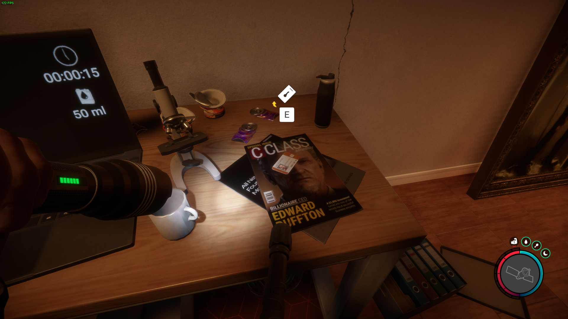 Locate the Maintenance Keycard resting on a table beside a 3D printer.
