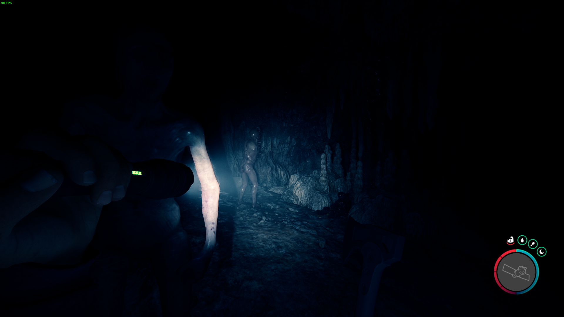 A wooden cross marks the way to the left, into the heart of the cave. 