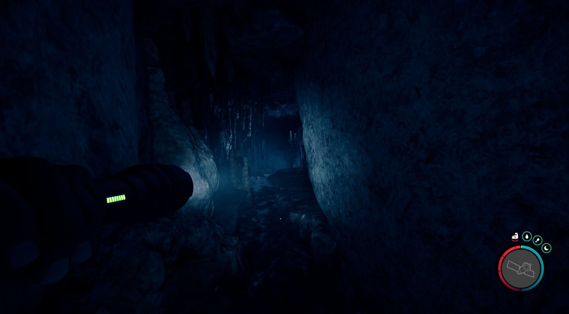 Steige mit der Seilpistole in die Dunkelheit hinab, um die weitläufigen Tiefen der Höhle zu erkunden.
