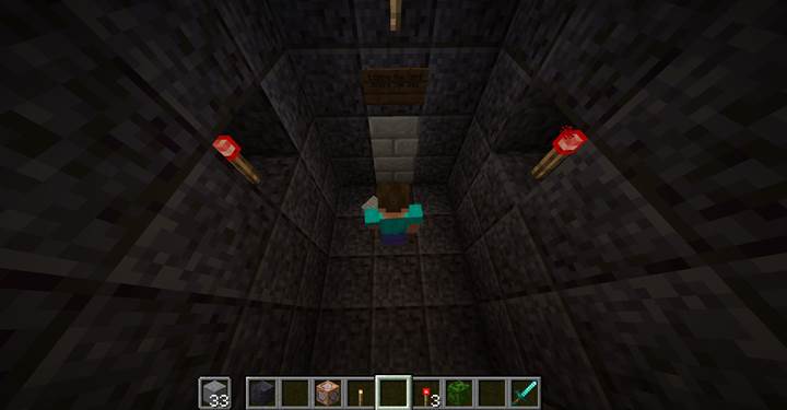 Build a fake wall that only disappears when both torches are gone.