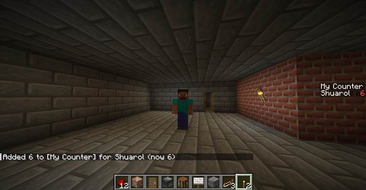 Dodaj graczowi punkty punktowe za pomocą przycisku z czerwonego kamienia i bloku poleceń w grze Minecraft.