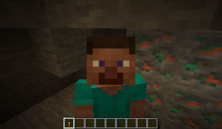 A massive copper vein snakes through layers of granite deep within a Minecraft dripstone cave system.