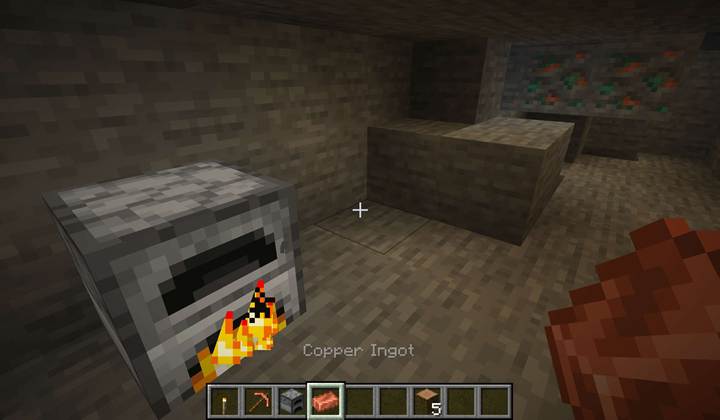 Rows of furnaces smelt stacks of raw copper into glowing ingots in a well-organized Minecraft survival base.