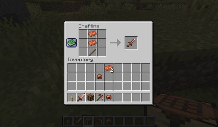 The Minecraft crafting table displays a copper sword recipe using two copper ingots and a wooden stick.