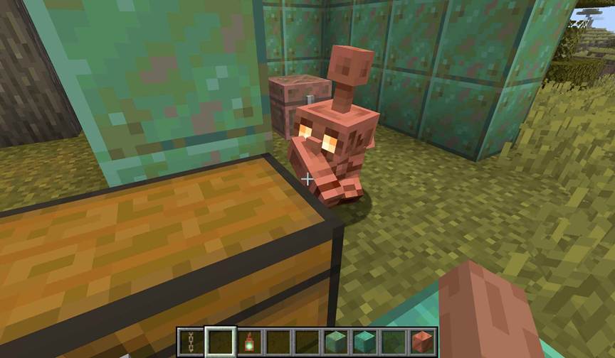 In Minecraft, oxidized copper golem statues line a factory wall, doubling as redstone triggers that control machinery and lighting.